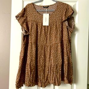 This can be worn a top or a mini dress!!